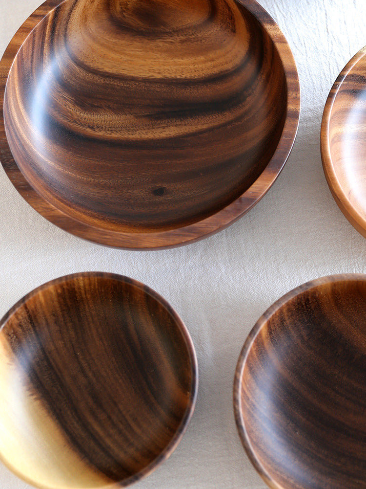 Natural wooden salad bowl from LuxeGlow Essentials, perfect for serving fruit or salads in home or restaurant settings.