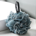 PureGlow soft bubble bath loofah ball for gentle exfoliation and luxurious bathing, shown in a close-up image.