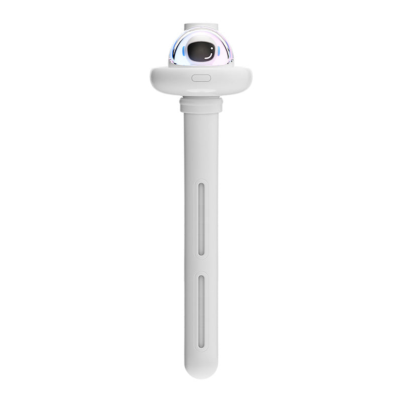 PureGlow astronaut-shaped portable mini humidifier on a wooden surface, showcasing its compact design and white finish.