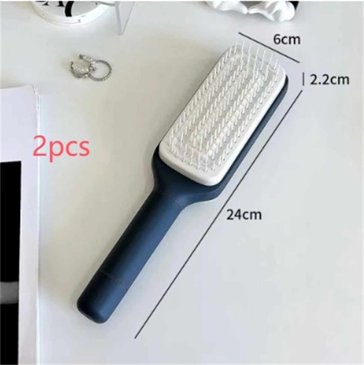 PureGlow self-cleaning 4-in-1 hair brush with ergonomic handle and versatile design for styling and detangling hair.