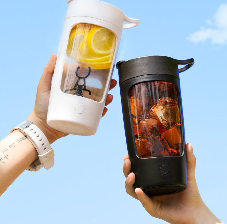 PureGlow portable juice blender with transparent blending jar and control buttons, ideal for making smoothies on the go.