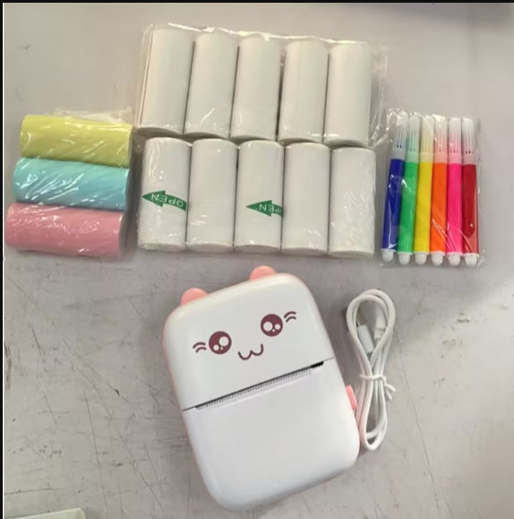 PureGlow portable mini Bluetooth WiFi baby care printer printing a mobile phone photo with colorful notes and labels.