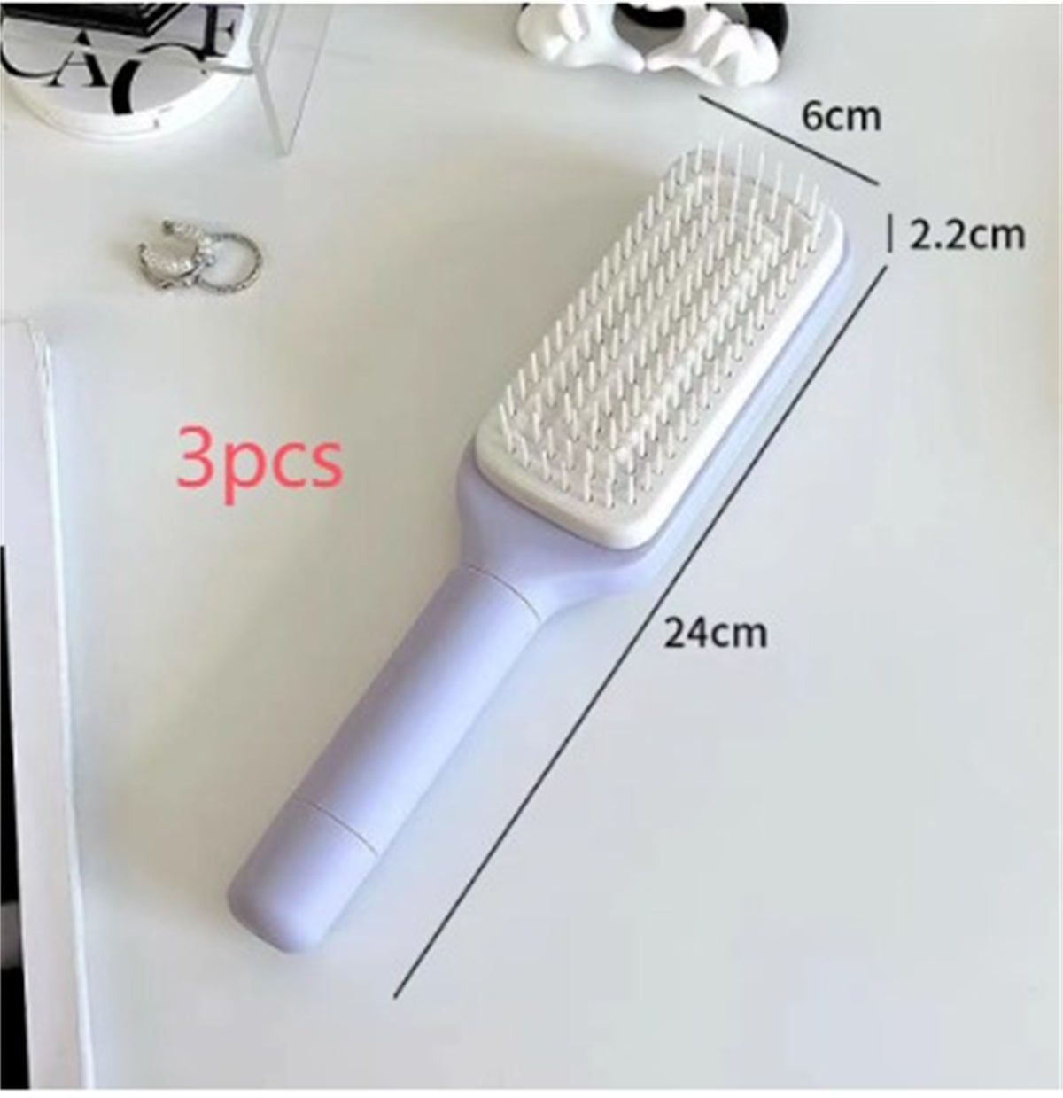 PureGlow self-cleaning 4-in-1 hair brush with ergonomic design, showcasing flexible bristles and sleek handle for versatile hair styling