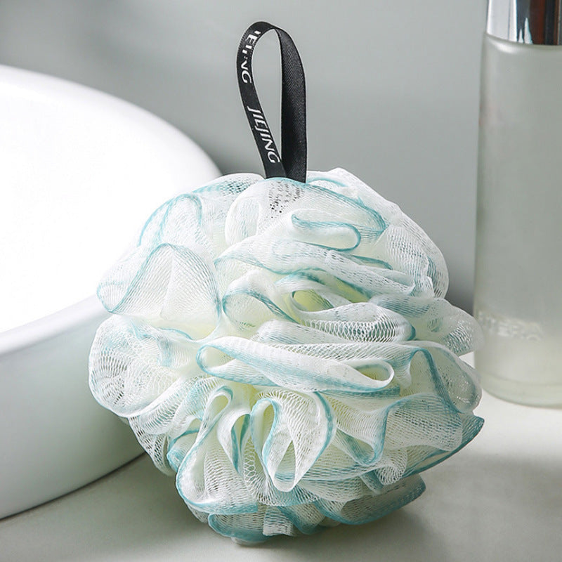 PureGlow soft bubble bath loofah ball for gentle exfoliation and luxurious bathing, shown in a close-up image.