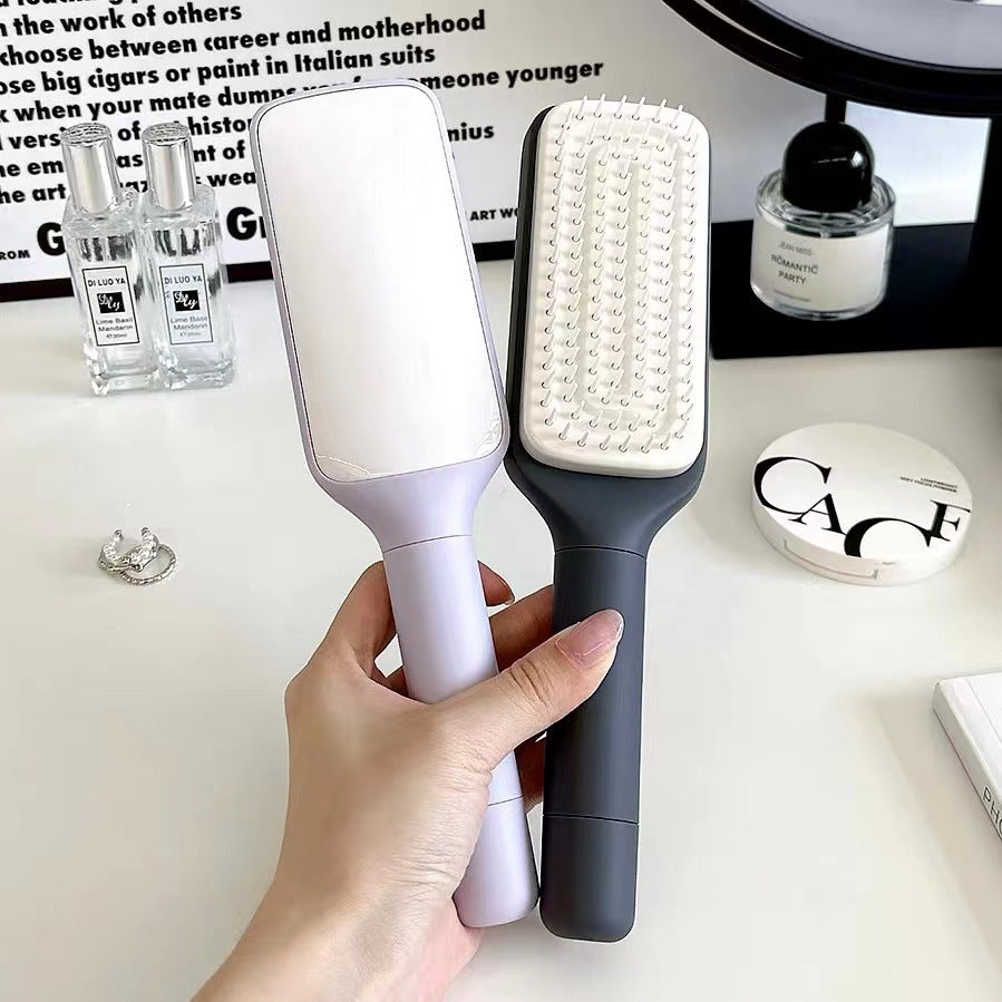 PureGlow Self-Cleaning 4-in-1 Hair Brush with ergonomic handle, showcasing versatile hair styling and detangling features.