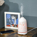 PureGlow 100ml ultrasonic aromatherapy diffuser displaying a sleek white design on a wooden surface.