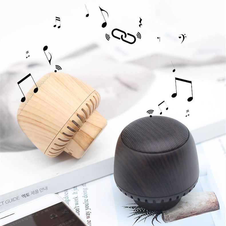 LuxeGlow Essentials portable mushroom-shaped TWS audio box with LED night light and compact design, ideal for easy music listening.